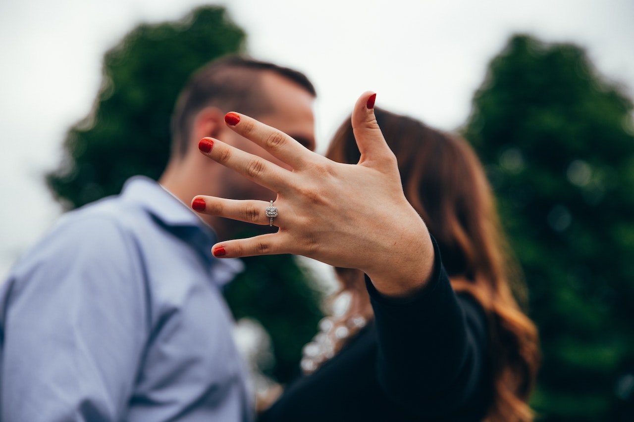 Showing engagement ring