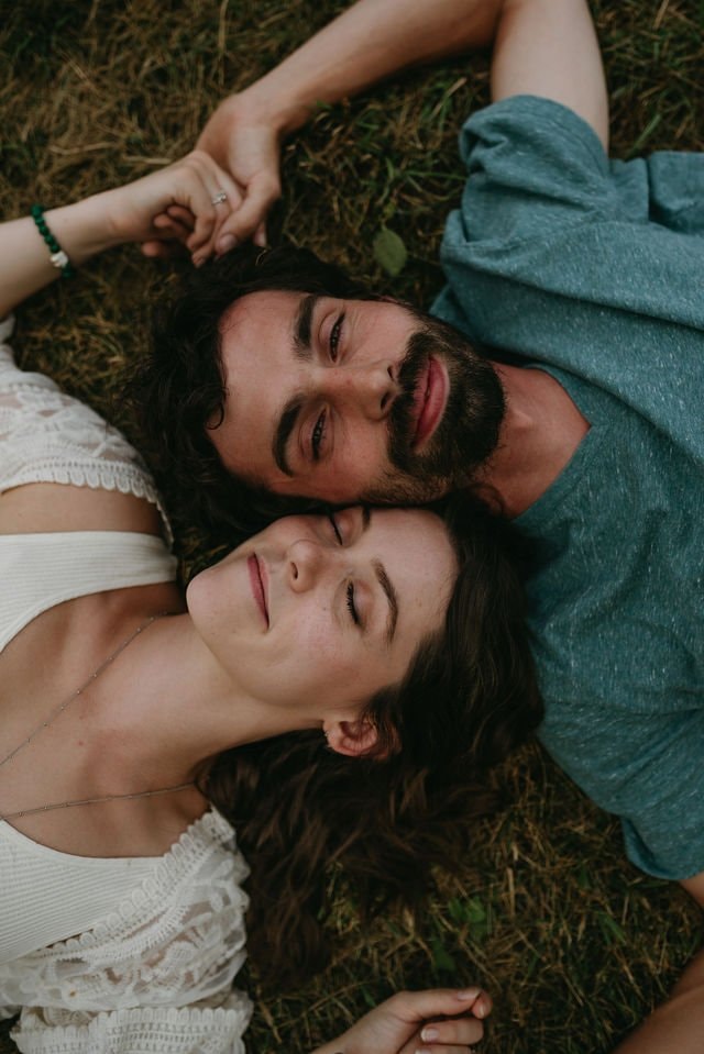 Engage couple laying on the field | Wedding Photography | Cherished memories studio
