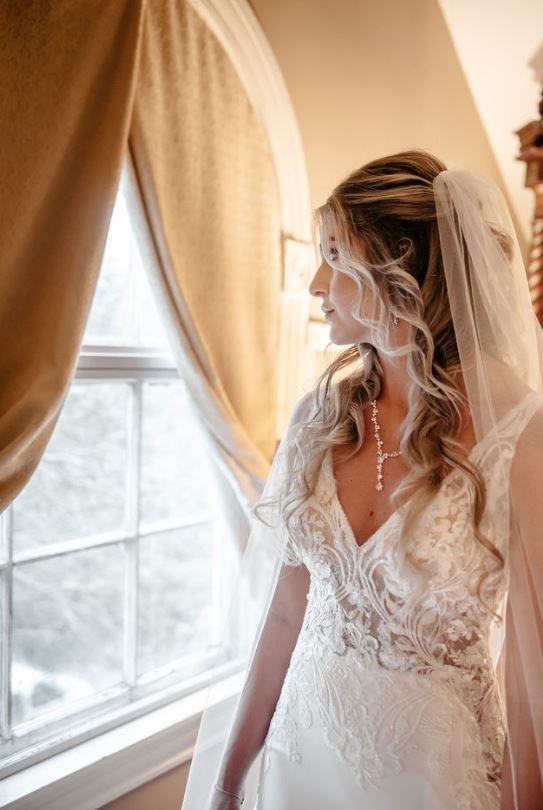 Bride looking at the window | Client Portal | Cherished memories studio