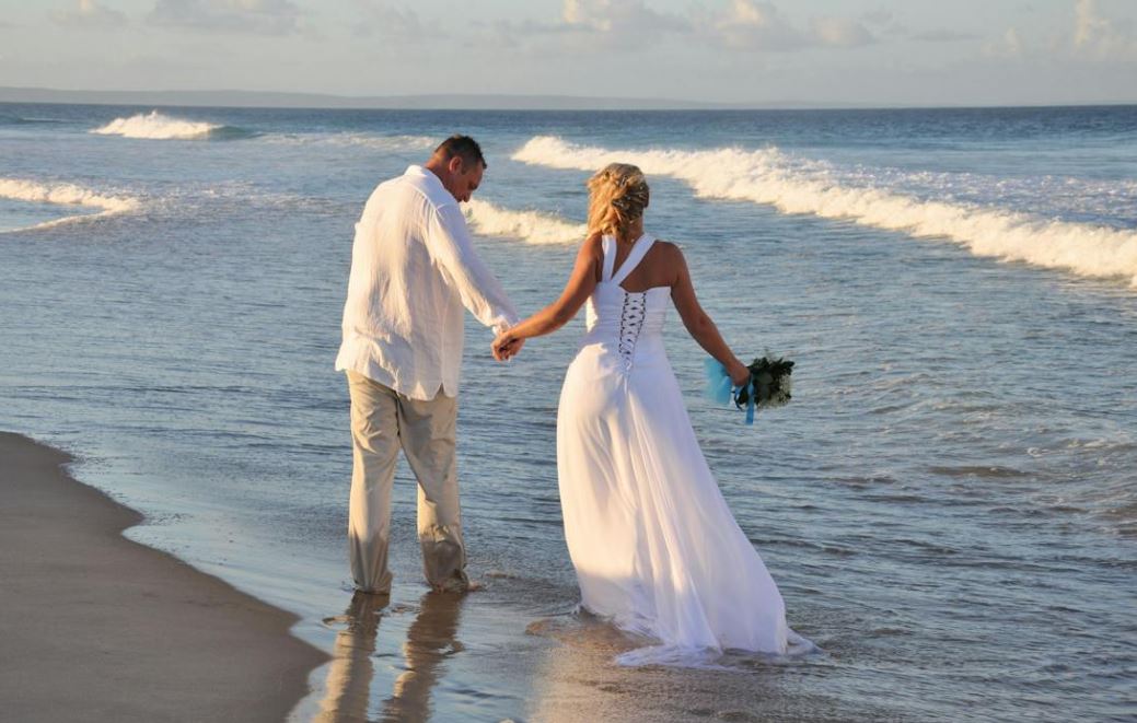 Married couple walking on the seaside | Cherished memories studio