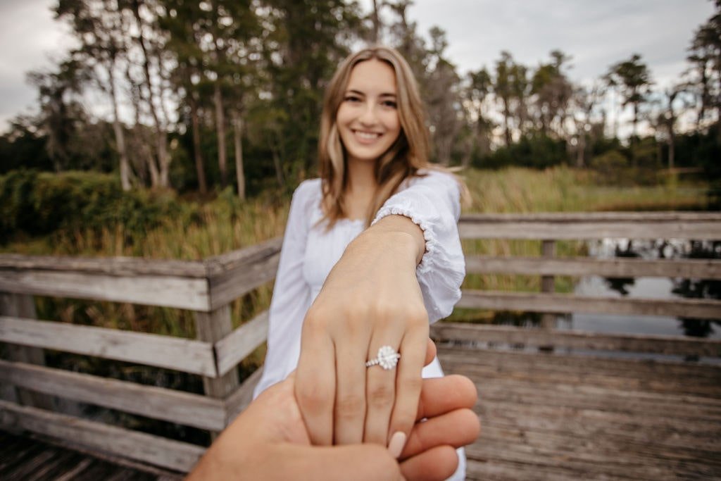 Girl showing her engagement ring | Cherished Memories Studio