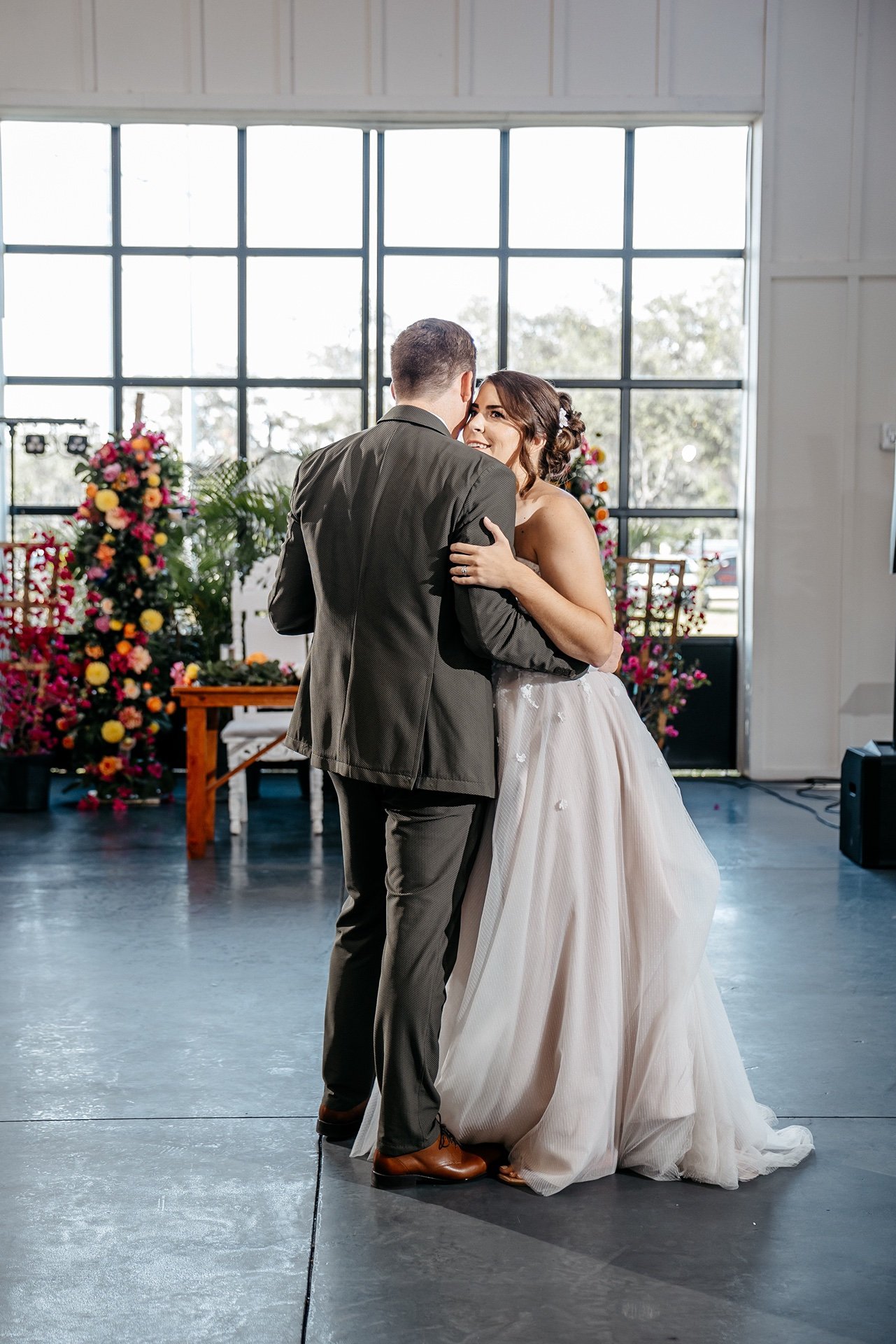 A bride dances with her groom at their wedding reception in florida