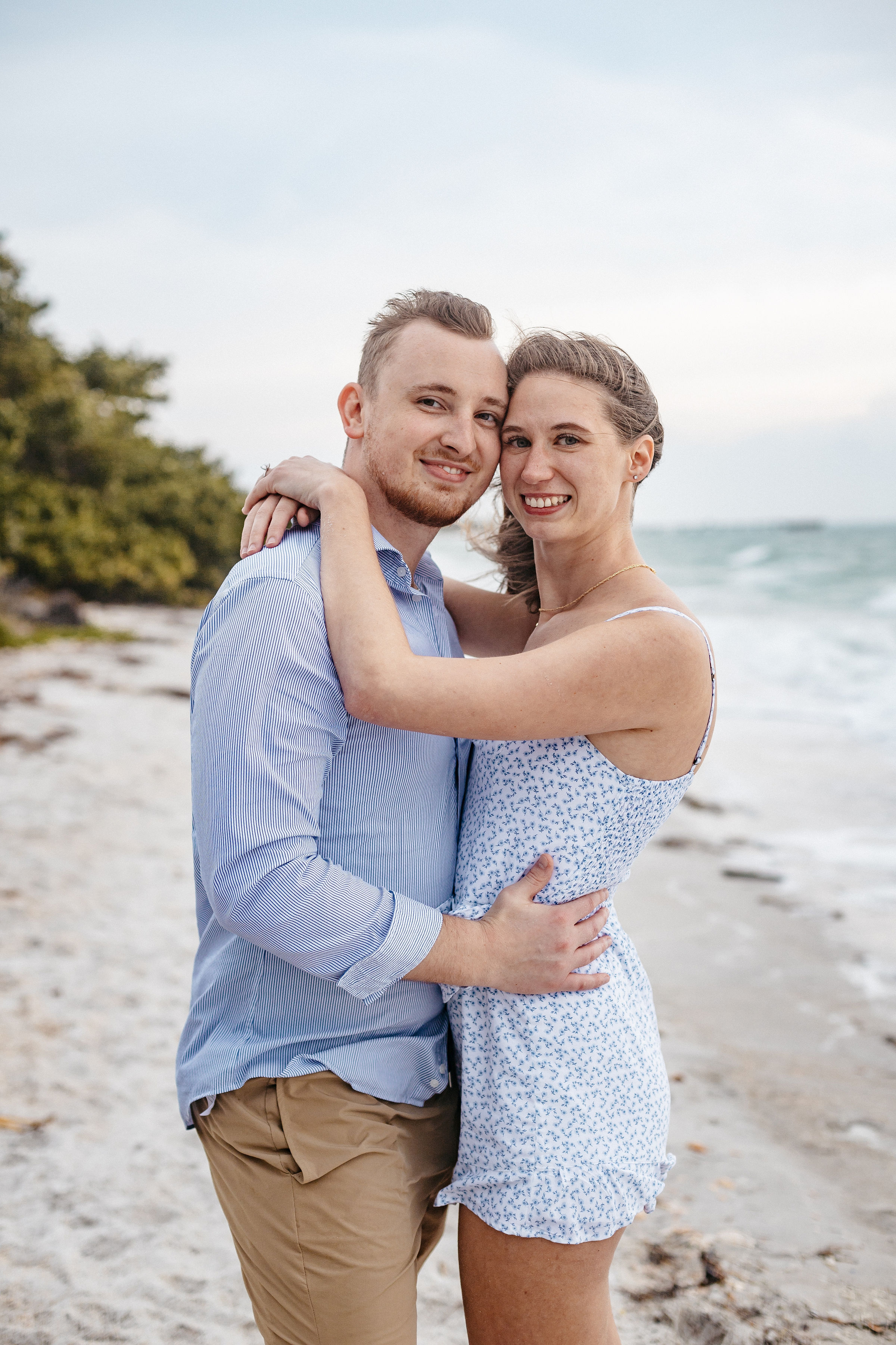 Couple hugging each other after the engagement | Cherished memories studio