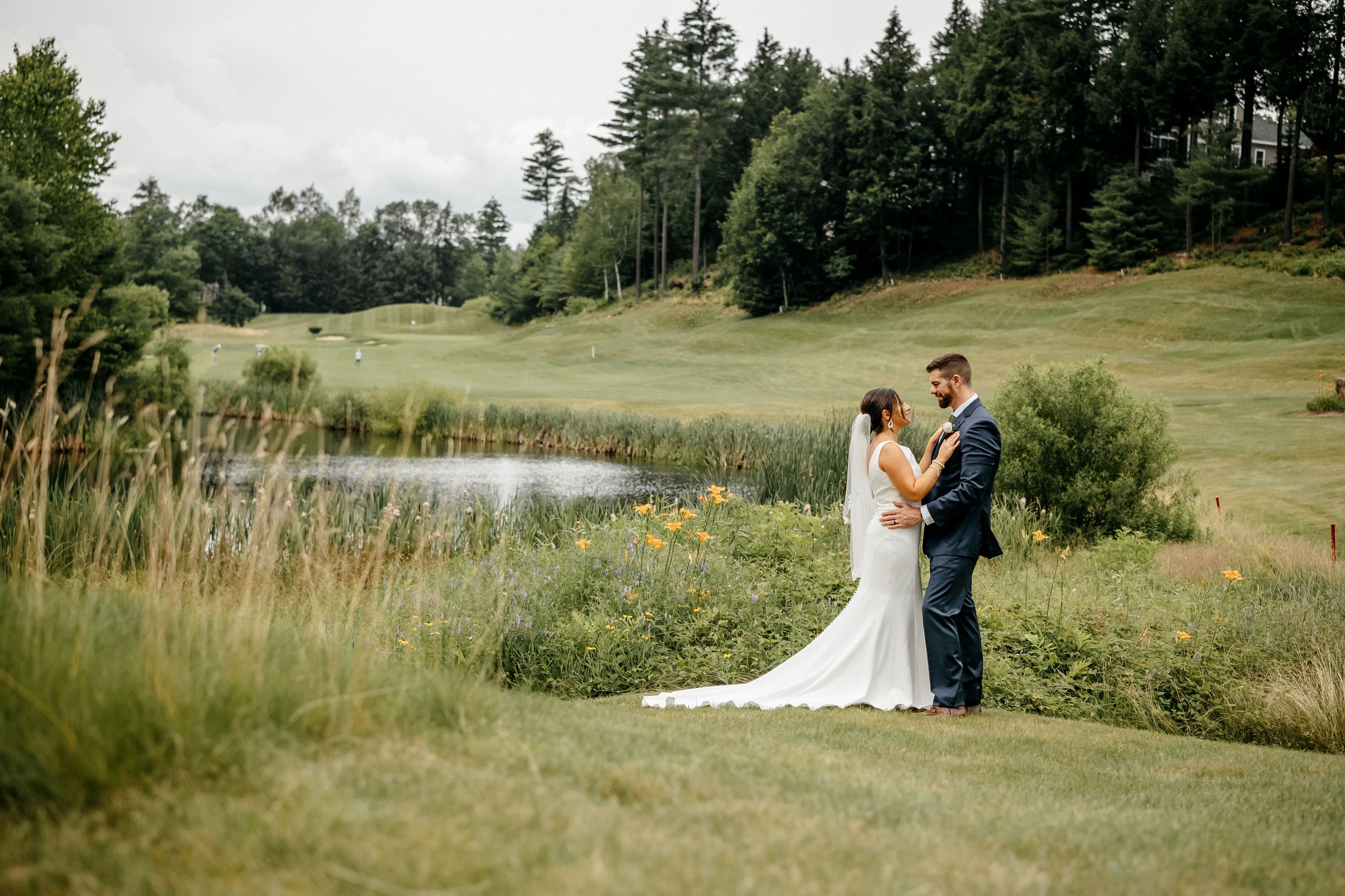 vineyards | Bride and groom kissing beneath the river | Cherished Memories Studio