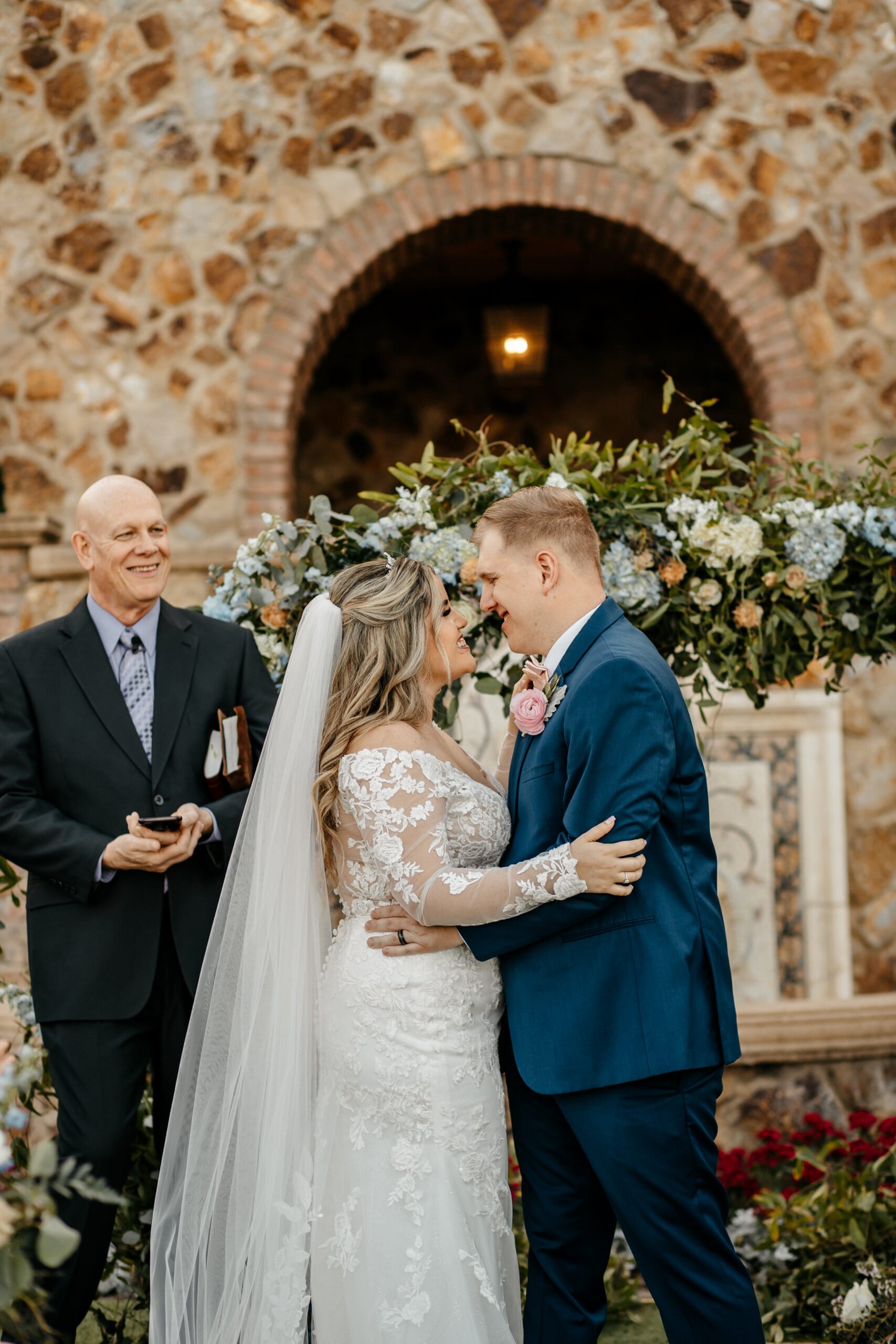 Bride and groom hold each other and smile after saying their vows at their Bella Collina wedding in Florida