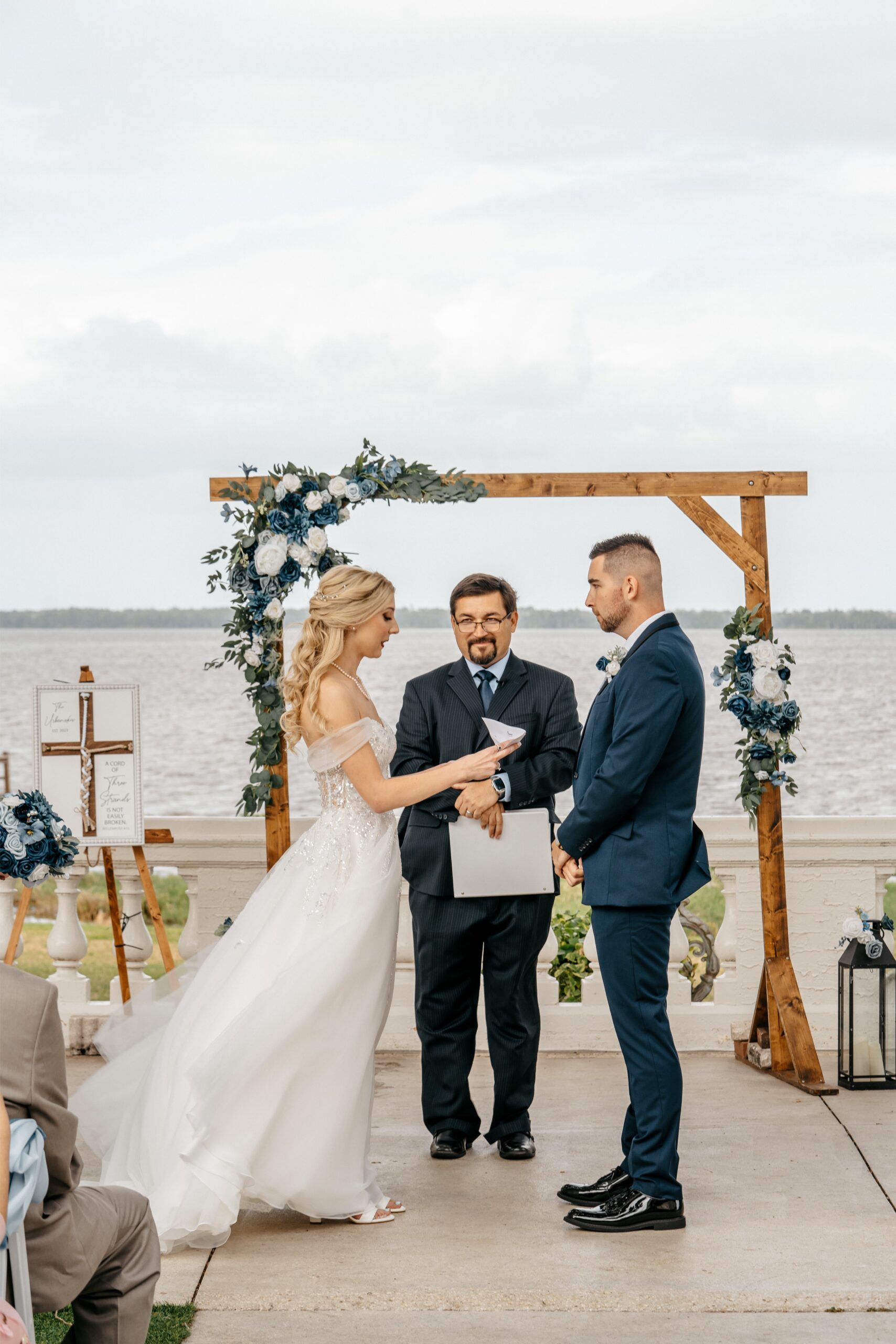 Central Florida wedding videographer captures the moment a bride reads her vows to her husband at their Central Florida wedding