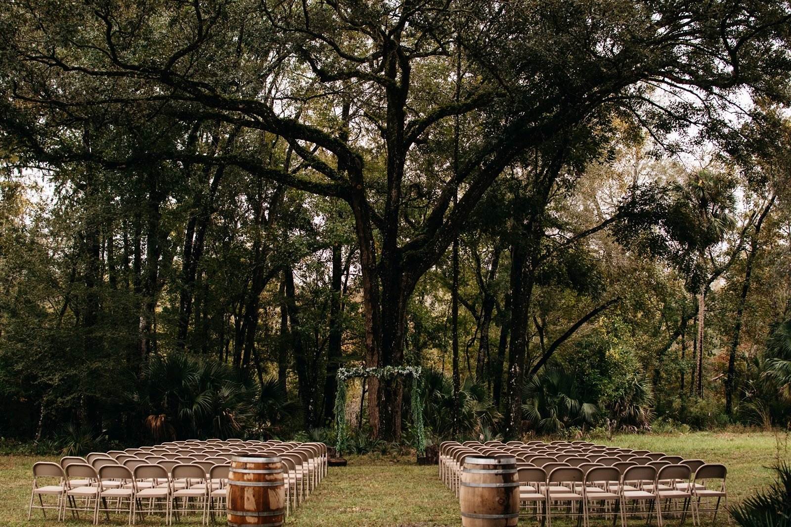 A beautiful outdoor venue boats a backdrop of greenery at bear tree barn
