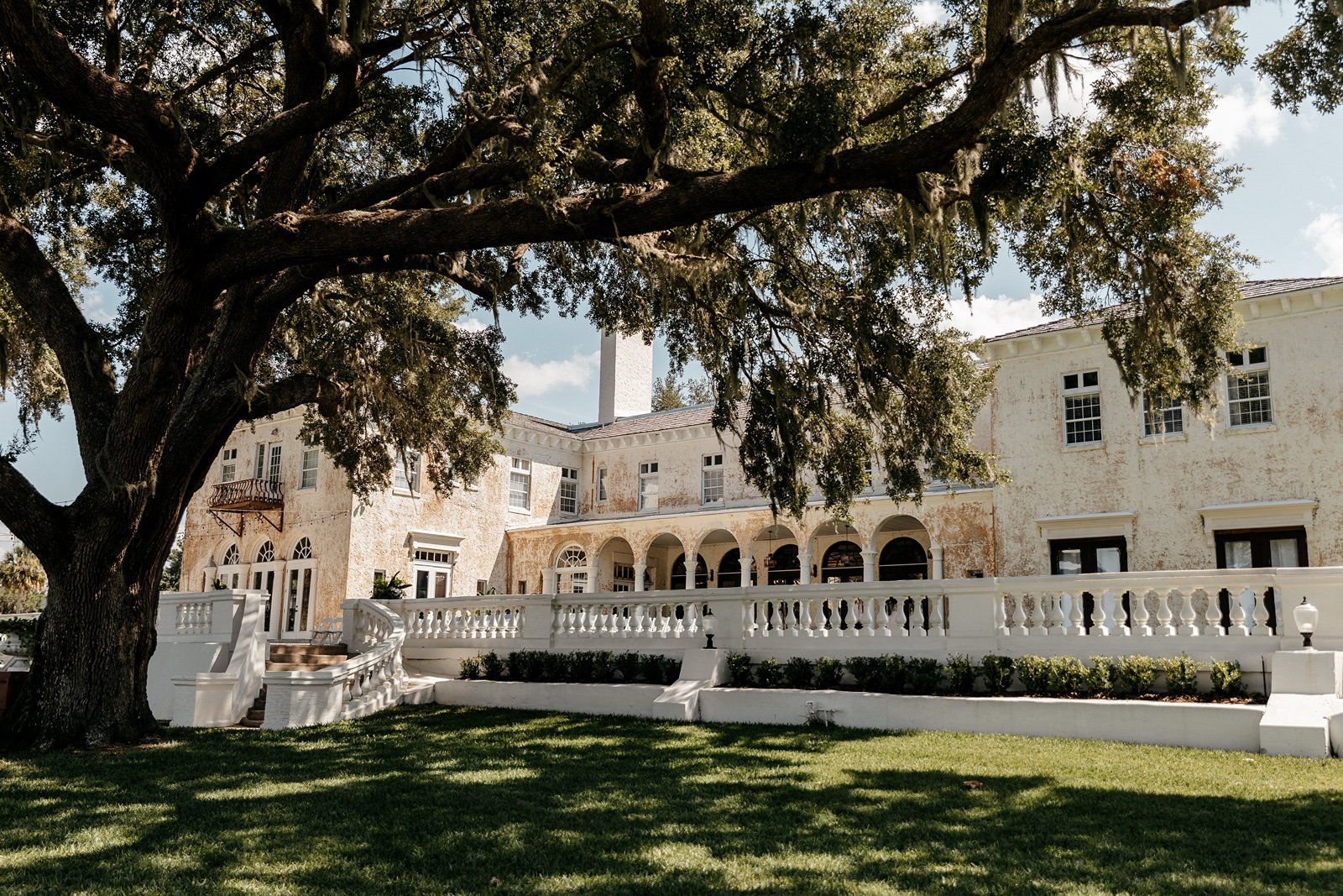 A beautiful old-fashioned building is part of the bella cosa lakeside wedding venue photos
