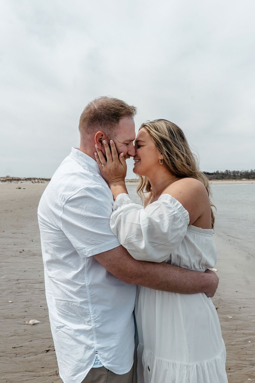 Couple embracing on a Florida beach during a romantic photography session