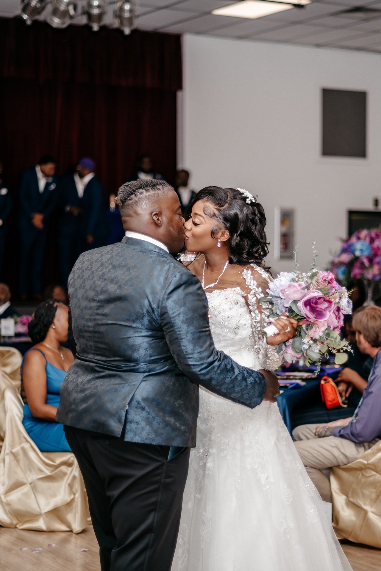 A bride kisses her groom on the dance floor at their wedding in Central Florida
