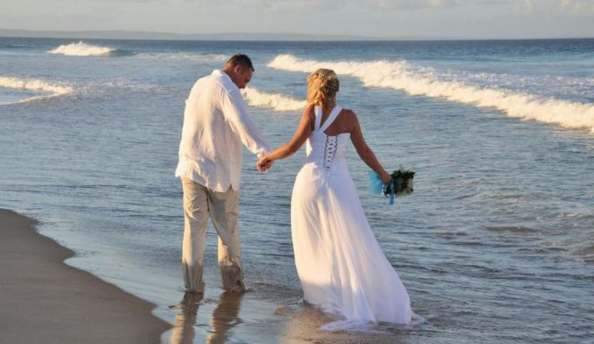 Married couple walking on the seaside | Cherished memories studio