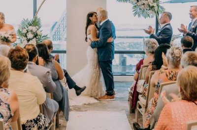 Married couple are kissing after the wedding ceremony | Wedding Photography